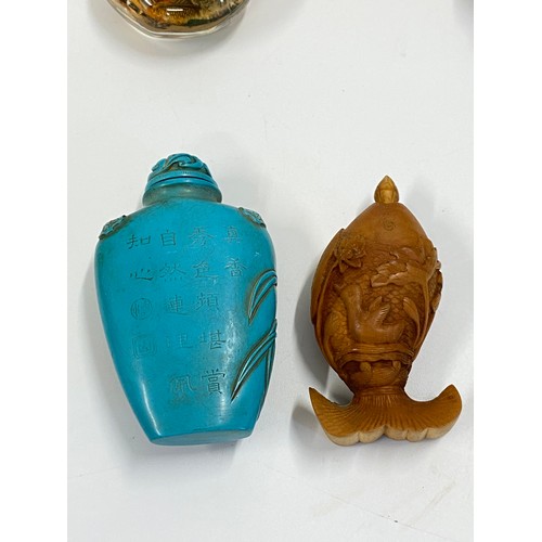 17 - A group of predominately oriental themed items consisting of snuff bottles, carved agate figures, va... 