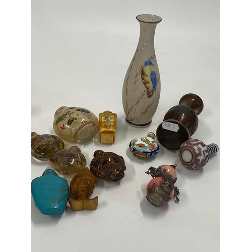 17 - A group of predominately oriental themed items consisting of snuff bottles, carved agate figures, va... 