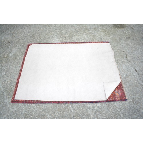 71 - Qashqai rectangular woolen rug with double lozenge design in reds and blues, size approx 144cms x 10... 