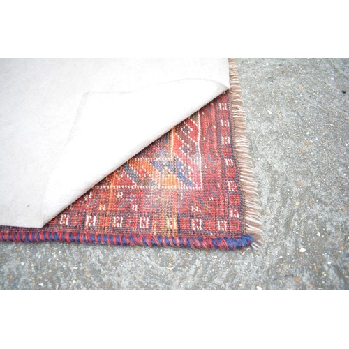 71 - Qashqai rectangular woolen rug with double lozenge design in reds and blues, size approx 144cms x 10... 