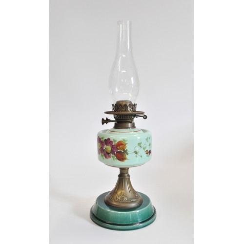 90 - Antique oil lamp with glass funnel and white glass shade, base decorated with flowers. Approx H56cms