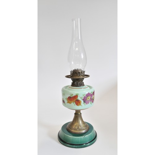 90 - Antique oil lamp with glass funnel and white glass shade, base decorated with flowers. Approx H56cms