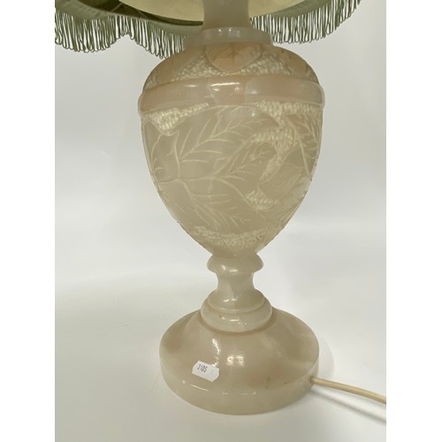 94 - Vintage Onyx Lamp with hand carved floral/leaf design to base, approx H74cm. PAT tested.