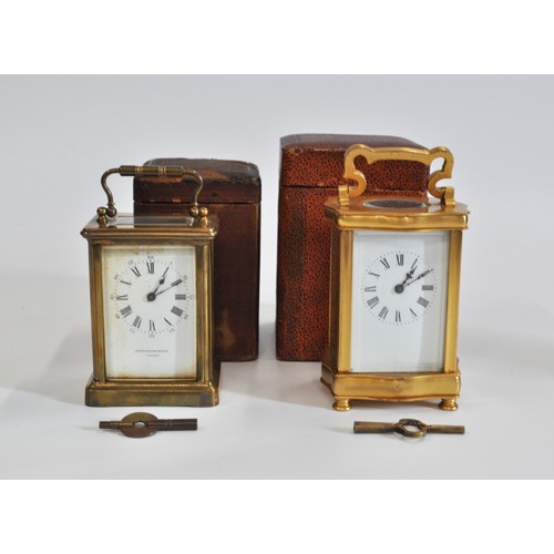 95 - x2 brass carriage clocks both with travelling cases and keys,  white dial with Roman numerals, one i... 