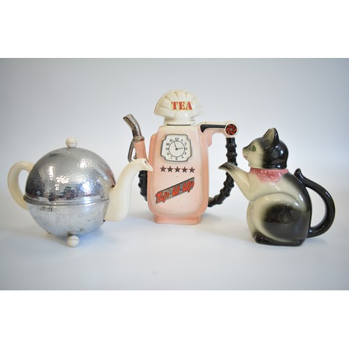 109 - Group of retro novelty teapots to include Petrol/gasoline Pump by Sunshine Ceramics, Erphilia black ... 