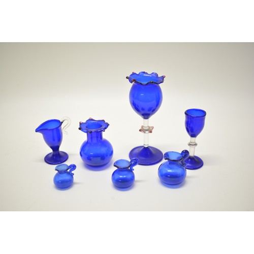 130 - Collection of antique and vintage blue glass, some Georgian and Victorian items including buttons, m... 