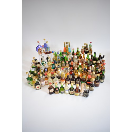 145 - An assortment of alcohol miniatures to include Vodka, Gin, Liqueurs, and whiskies