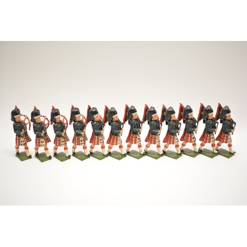 190 - Britains set of 12 die cast highlanders piping soldier figures. 6.5 cm