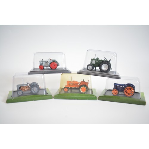 219 - Various boxed model vehicles and makers to include tractors, cars, buses and fire engines, plus Dink... 