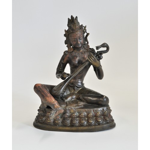 237 - Bronzed figure of a goddess, 19th/20th century Probably Saraswati, modelled in dancing pose and play... 