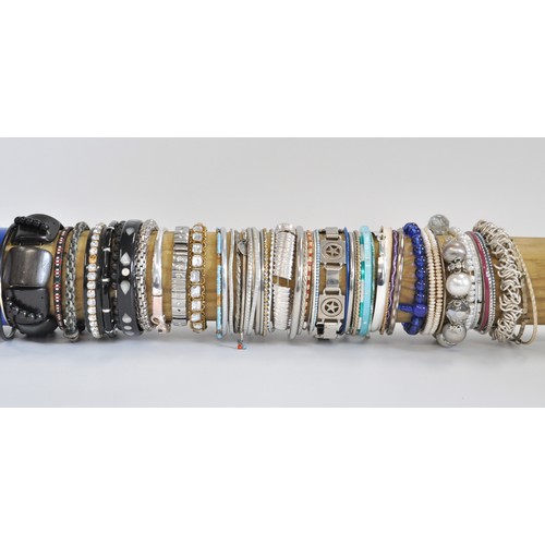 260 - A large collection of bangles/bracelets, various colours and designs