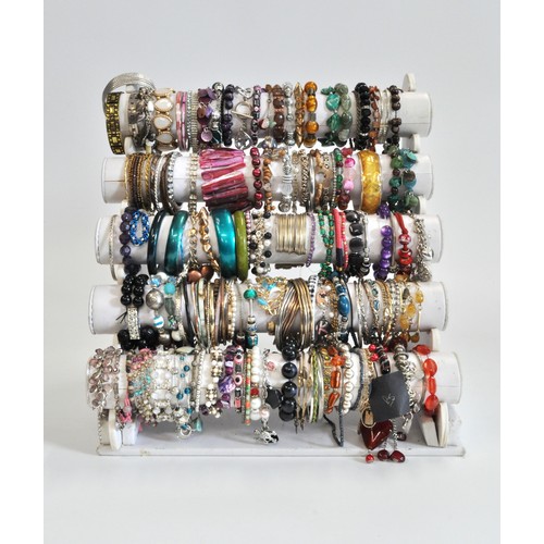 271 - x5 tiers of costume jewellery bracelets, various styles and metals, beads etc.  in excess of over 10... 