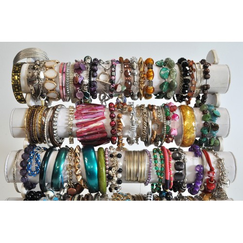 271 - x5 tiers of costume jewellery bracelets, various styles and metals, beads etc.  in excess of over 10... 