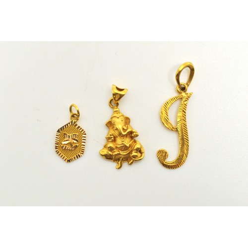 281 - x3 yellow gold pendants, the Ganesha is stamped 916. approx gross combined weight 7.63g.