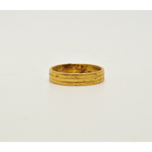 282 - Yellow gold band stamped 916, approx 4g.