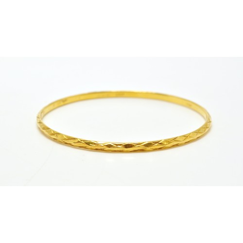 296 - Yellow gold bangles of same design, stamped 22K, approx combined gross weight 22.5g.