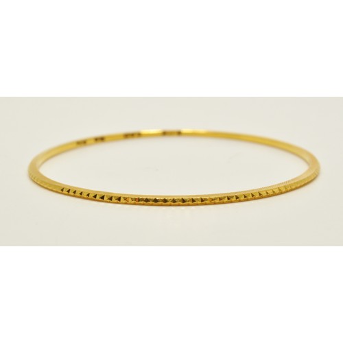 296 - Yellow gold bangles of same design, stamped 22K, approx combined gross weight 22.5g.