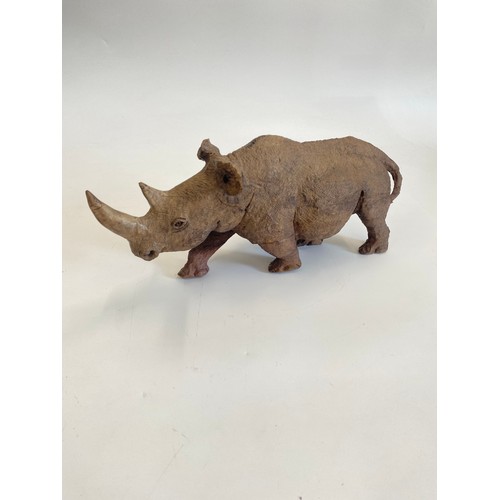 16 - Hand carved sculpture of a rhinoceros, AF - Approx height: 30cm - photo to follow