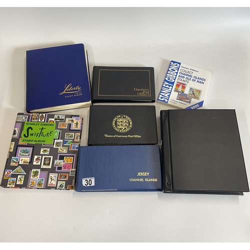 30 - X2 stamp albums containing various worldwide stamps together with Jersey and Guernsey and various Fi... 