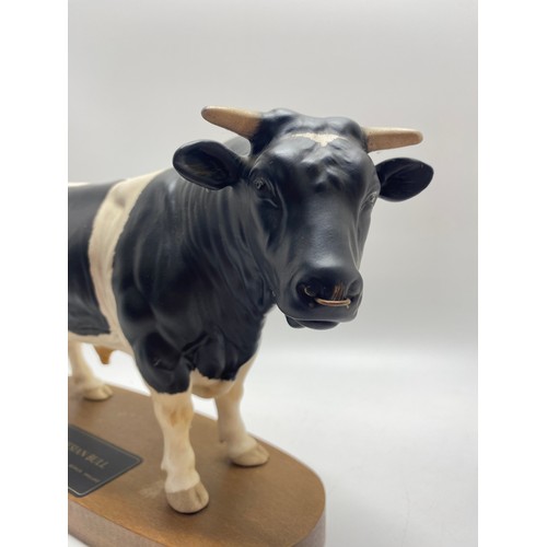 307 - Large Beswick Friessian Bull together with  Beswick Jersey cow and Beswick Highland Calf.