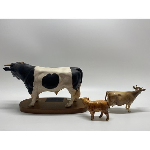 307 - Large Beswick Friessian Bull together with  Beswick Jersey cow and Beswick Highland Calf.