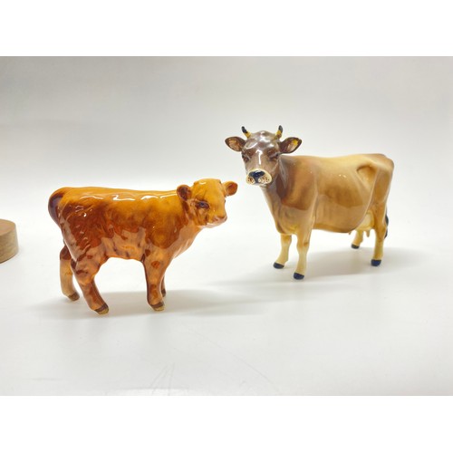 307 - Large Beswick Friessian Bull together with  Beswick Jersey cow and Beswick Highland Calf.