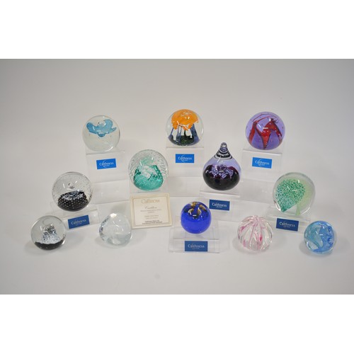 4 - x12 Caithness glass paperweights of various sizes and designs to include; Cauldron, Starlight, Sarac... 