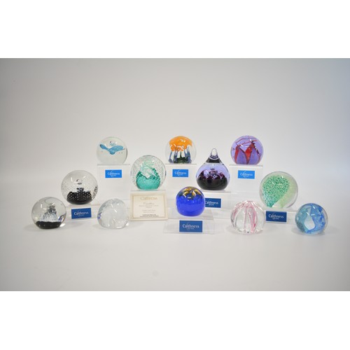 4 - x12 Caithness glass paperweights of various sizes and designs to include; Cauldron, Starlight, Sarac... 