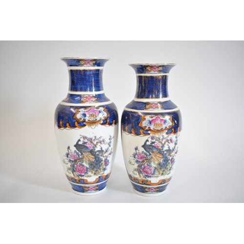 32 - Oriental items group consisting two pairs of vases, Qing Dynasty style warriors in battle famille ve... 