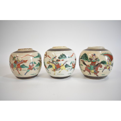 32 - Oriental items group consisting two pairs of vases, Qing Dynasty style warriors in battle famille ve... 