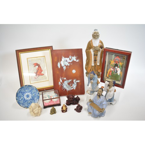 35 - A group of oriental items to include a oriental style eggs in presentation box and figures such as b... 