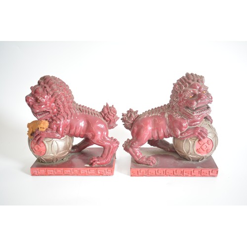 37 - A pair of lightweight decorative Foo Dogs approx 22cm height