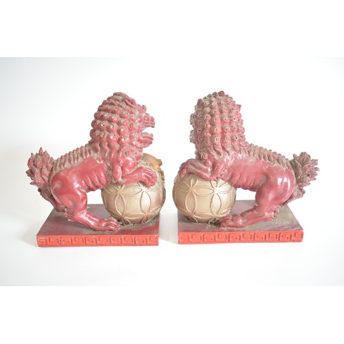 37 - A pair of lightweight decorative Foo Dogs approx 22cm height