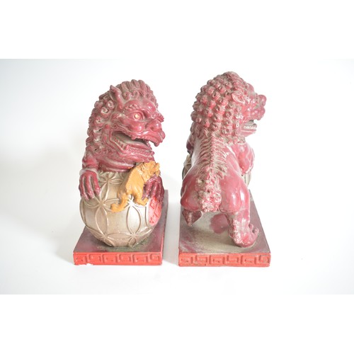 37 - A pair of lightweight decorative Foo Dogs approx 22cm height