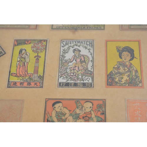 51 - Framed display of Japanese matchbox covers, approx frame size 42.5cm x 34.75cm.