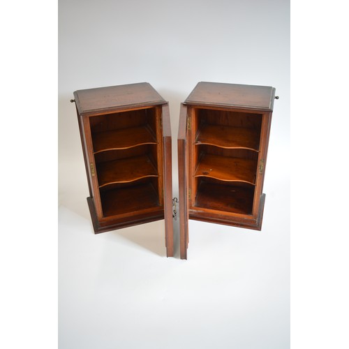 59 - A pair of mahogony cabinets with bevelled mirror to front. H45.5cm x W30cm x D23cm.