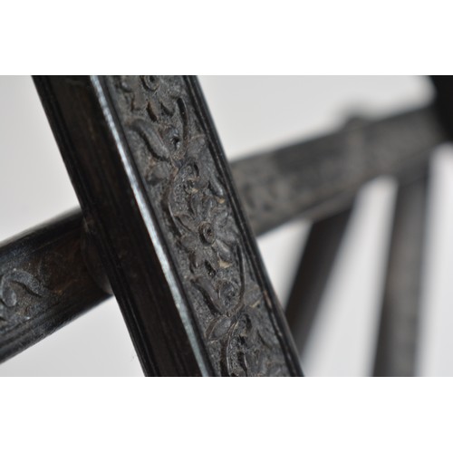 63 - Vintage ebonised Easel with carved scroll foliate design. size 40cms widest point, 62 cms tall