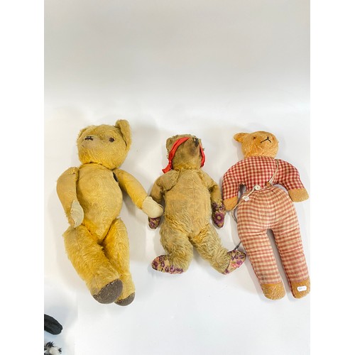 104 - A vintage cot containing Vintage pre-loved Teddy Bears, & two hand puppets