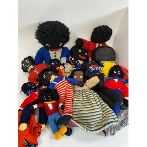 128 - Box full of handcrafted retro gollies
in various materials and an upside-down cloth doll