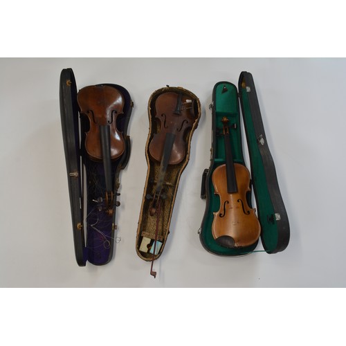 163 - 3 cased violins 2 with bows, 
x1 labelled Andreos Amati Setit Crenono Anno, 2 with no labels. Approx... 