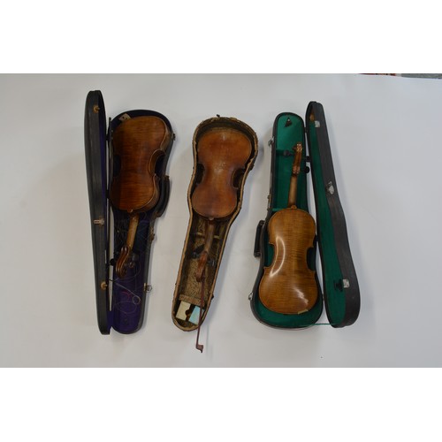 163 - 3 cased violins 2 with bows, 
x1 labelled Andreos Amati Setit Crenono Anno, 2 with no labels. Approx... 