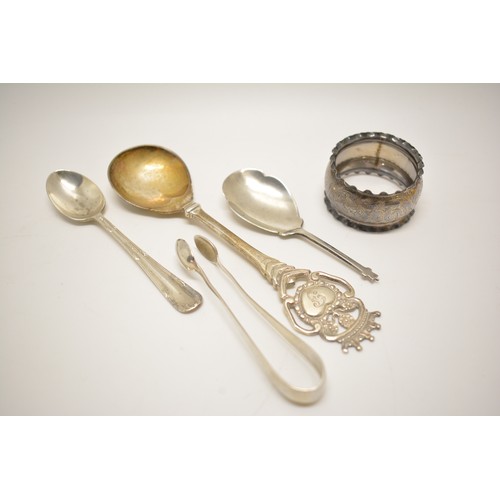 152A - A group of mixed silver items to include cruets, salt & pepers, tongs, spoons etc.