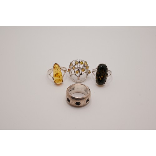 190 - x4 semi-precious rings, one tree of life design with possible yellow opal, two amber/amber style wit... 