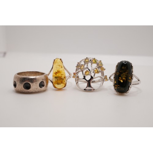 190 - x4 semi-precious rings, one tree of life design with possible yellow opal, two amber/amber style wit... 