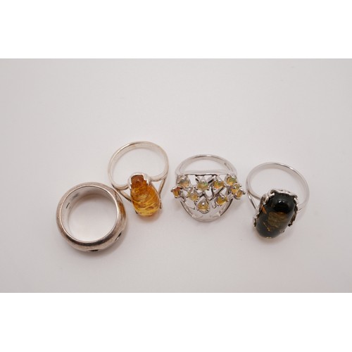 190 - x4 semi-precious rings, one tree of life design with possible yellow opal, two amber/amber style wit... 