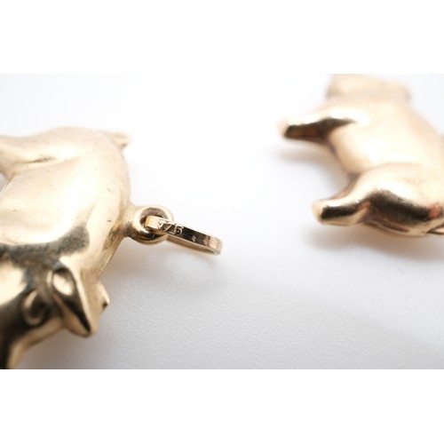 195 - Pair of 9ct yellow gold pig pendants, both stamped 375. Gross combined weight 1.13g