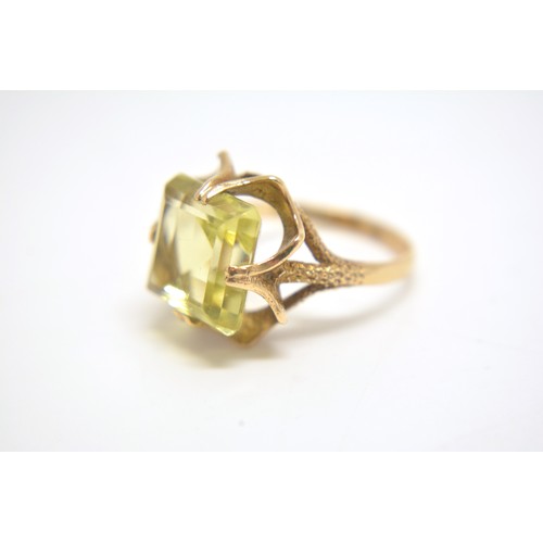 202 - 9ct yellow gold cocktail ring with rectangular yellow stone size N.