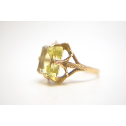 202 - 9ct yellow gold cocktail ring with rectangular yellow stone size N.