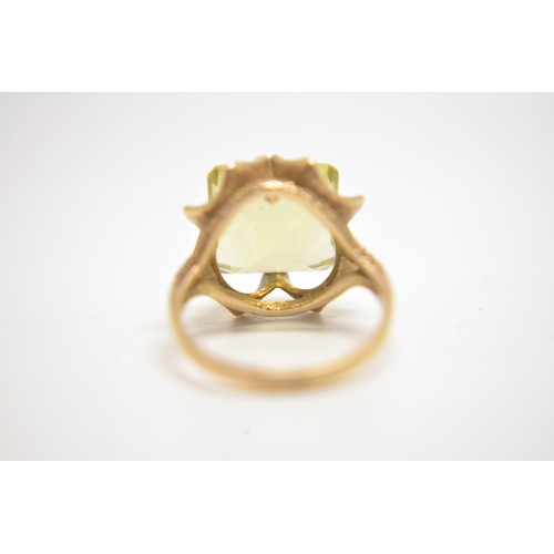 202 - 9ct yellow gold cocktail ring with rectangular yellow stone size N.