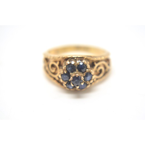 203 - 9ct yellow gold  sapphire cluster ring, scroll decoration to mount, size L/M